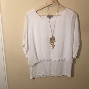 Sheer blouse with sewn in tank top. Cotton hem